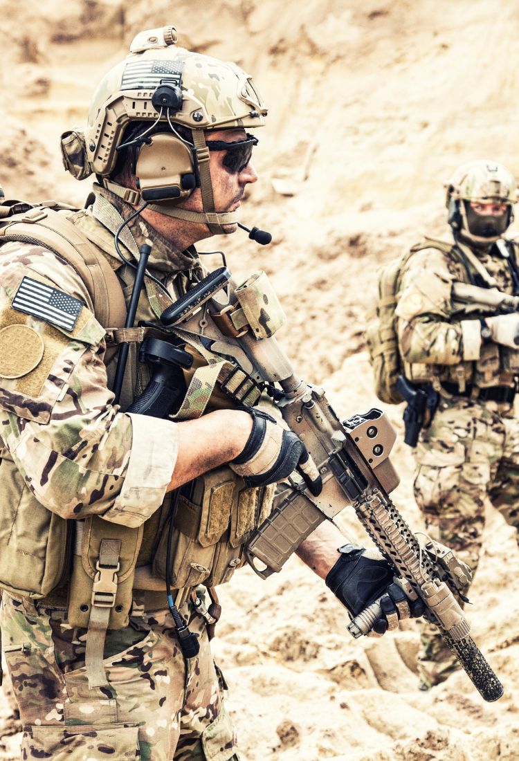 Two men wearing U.S. military unifroms with ballistic helmets and 3M comtac headsets.